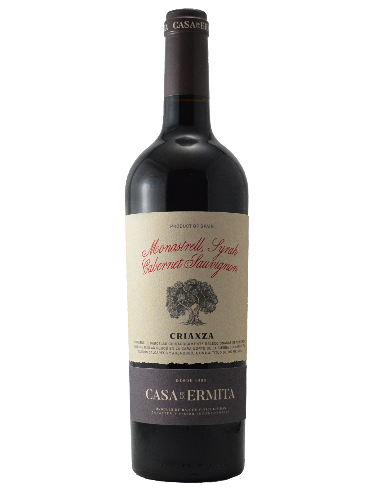 Red wine bottle with a label on a white background. Label reads 'Monastrell Syrah Cabernet Sauvignon' in red script text, has a picture of a tree, and 'Crianza' below it in black text. Bottom purple-grey label says 'Casa Ermita'. Dark purple-grey enclosure (cork).