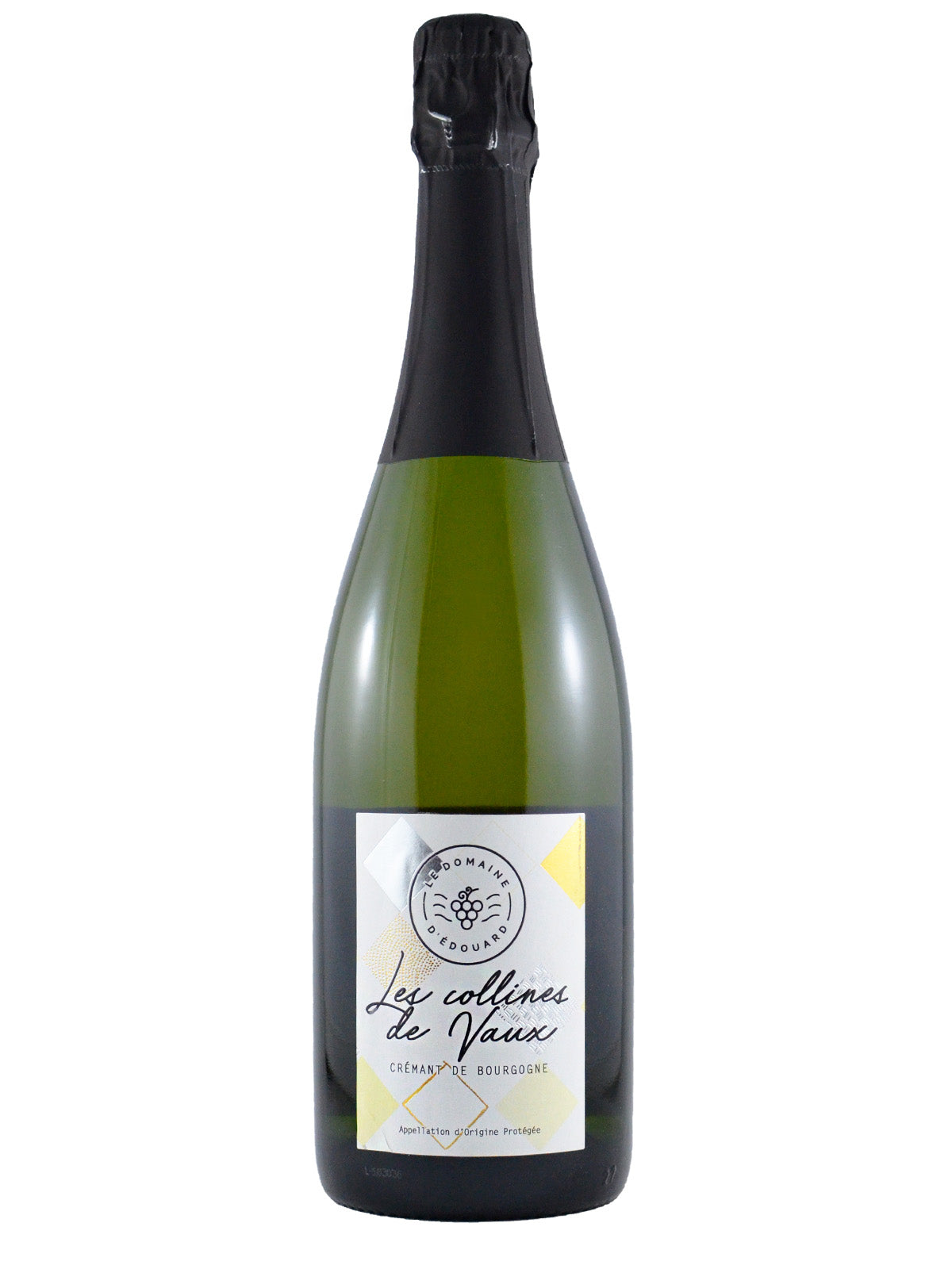 A bottle of Domaine d'Edouard Crémant de Bourgogne with a label that includes the text 'Les Collines de Vaux', its origin and a circle with the producer name a simple logo of a bunch of grapes. Black foil enclosure over green glass. All set against a white background.