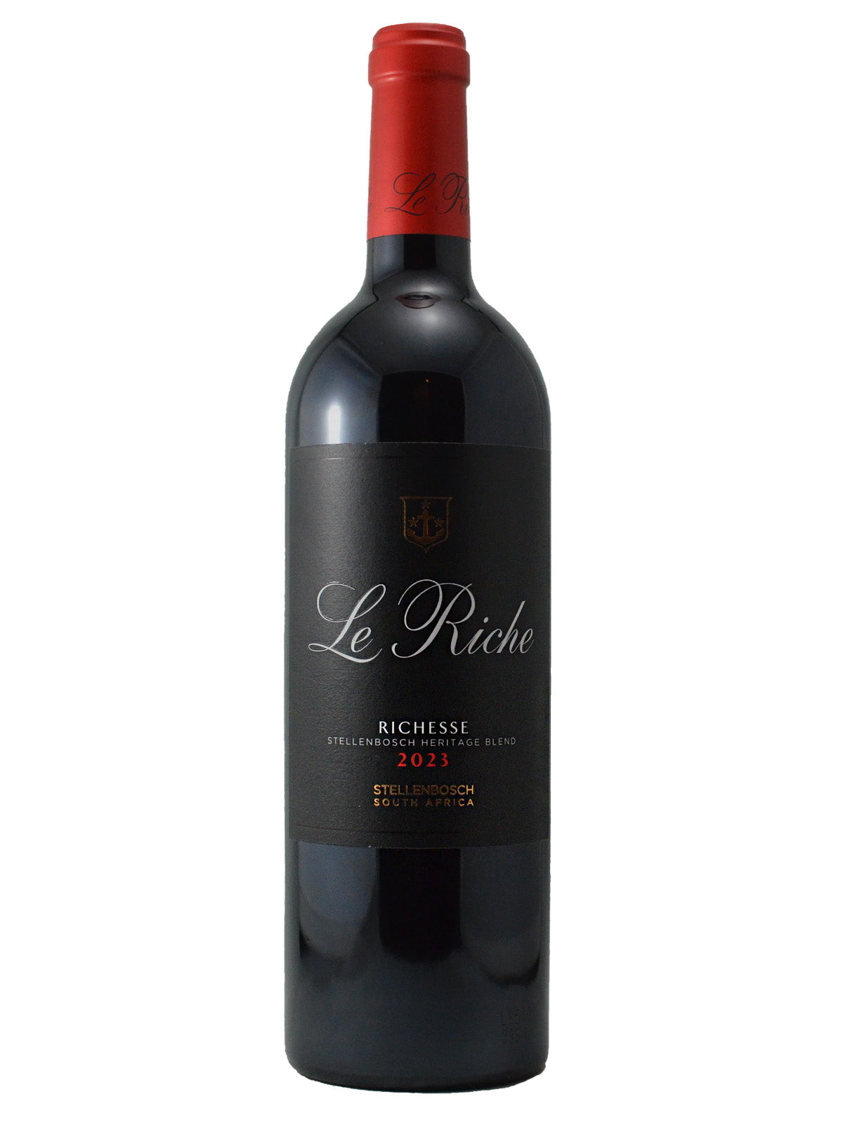 Wine bottle labeled 'Le Riche' set against a white background. Black label with white/red/gold text: in addition to wine name and maker, includes '2023' and 'Stellenbosch South Africa'. Bright red enclosure (cork).