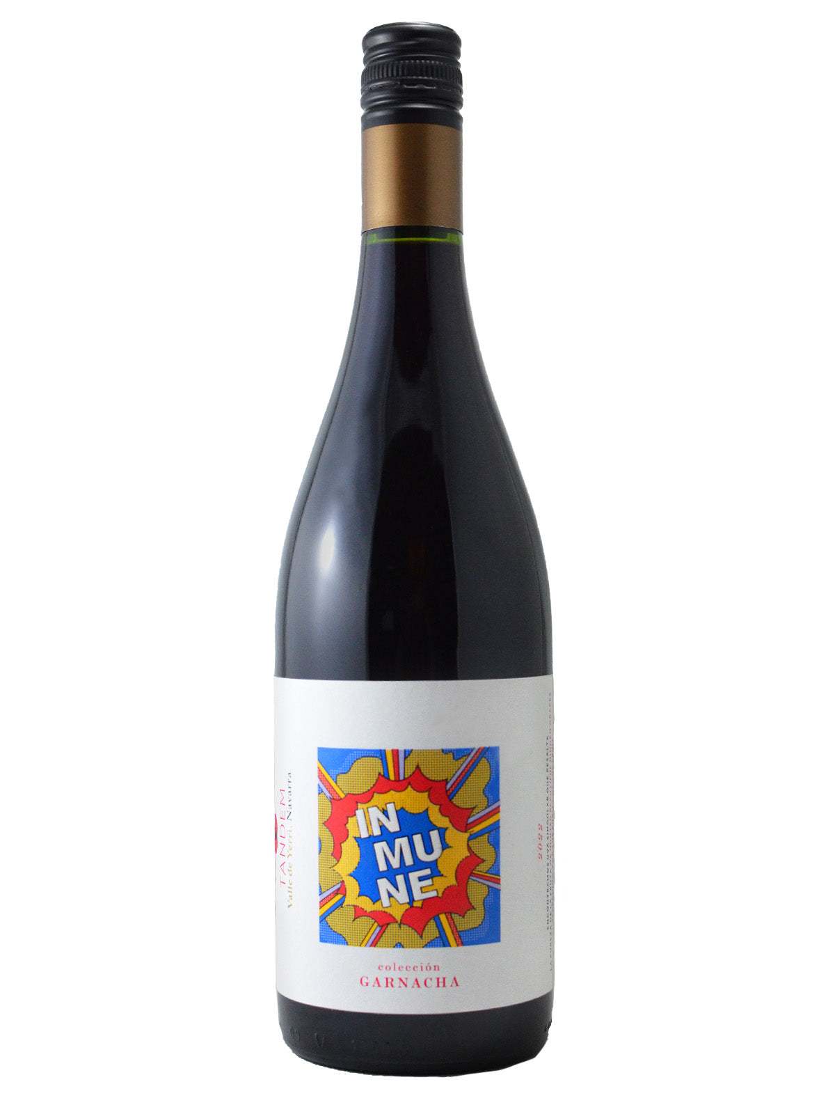 A bottle of Tandem Inmune Garnacha wine with a label featuring a colorful abstract pop art design with the word 'IN MU NE' split over three lines with an explosion behind it (reminiscent of the work of Roy Lichtenstein) and the text 'GARNACHA' at the bottom. Black screw cap enclosure with gold band around neck. All set against white background.