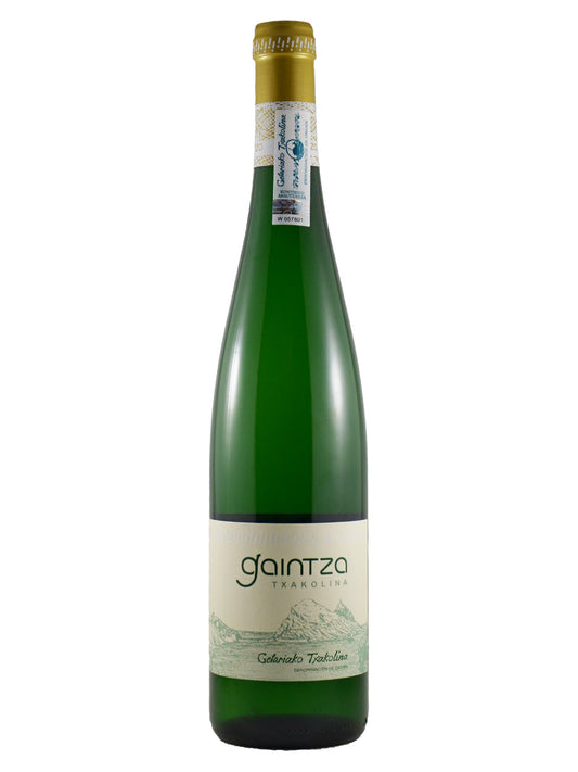 A bottle of Gaintza Terradito Colombari Toscano wine, featuring a dark green glass bottle with a gold foil top and a cream-colored label with green text and landscape illustration.