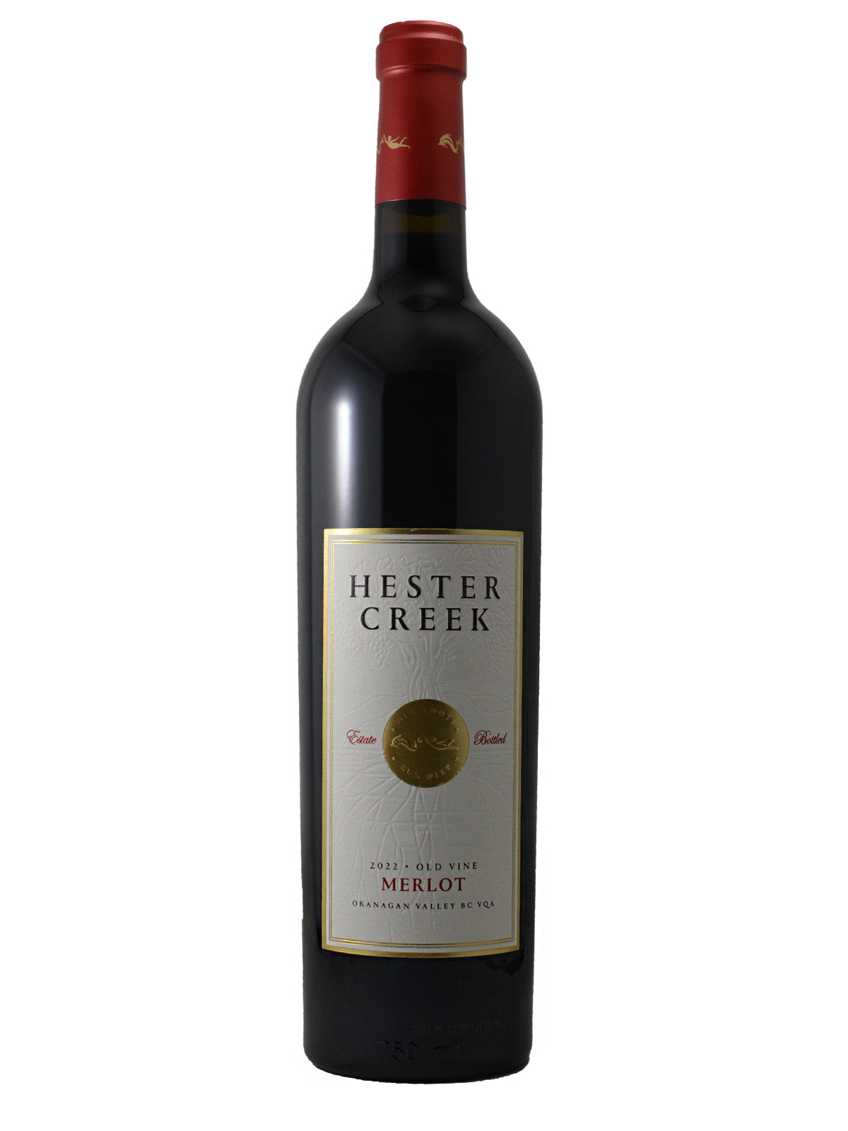 Hester Creek Merlot wine bottle on a white background. Gold medallion depicted on label surrounded by 'Estate Bottled' text. Other text on label reads '2022 Old Vine Merlot Okanagan Valley BC VQA'. Red cork enclosure.