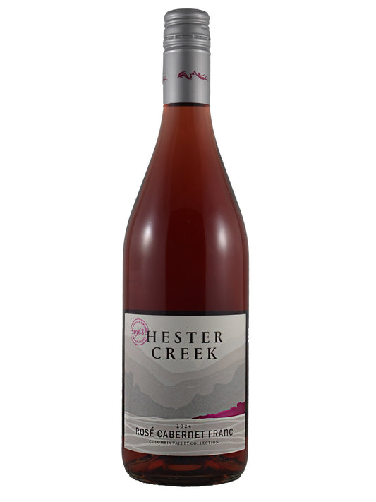 Wine bottle labeled 'Hester Creek' Rose Cabernet Franc on a white background with stylised lake or river against distant mountains. silver screw cap enclosure.