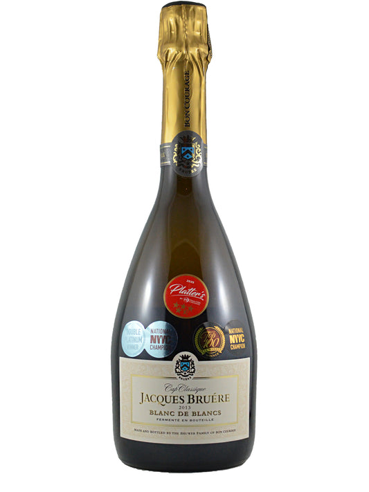 Bottle of Jacques Bruère Blanc de Blancs champagne with a gold foil top on a white background