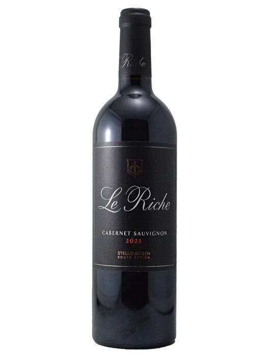 Wine bottle labeled 'Le Riche 2023 Stellenbosch' (white script/black label) on a white background