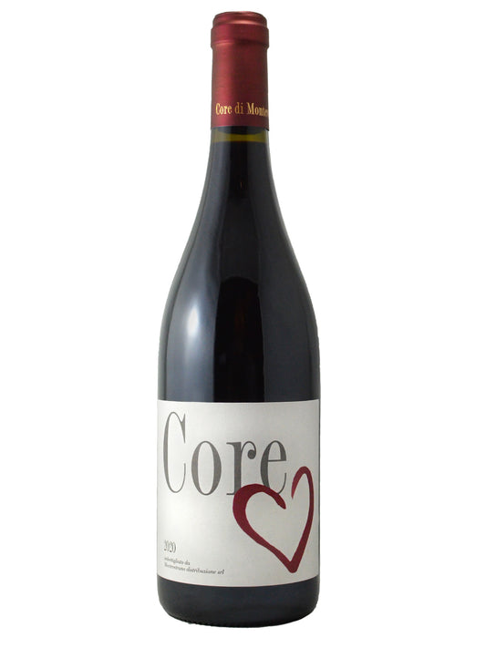 A bottle of Montevetrano Core Red wine with a white label that has the word 'Core' in grey with a drawn heart-shape in red below. Red capsule over cork enclosure. All set against white background.