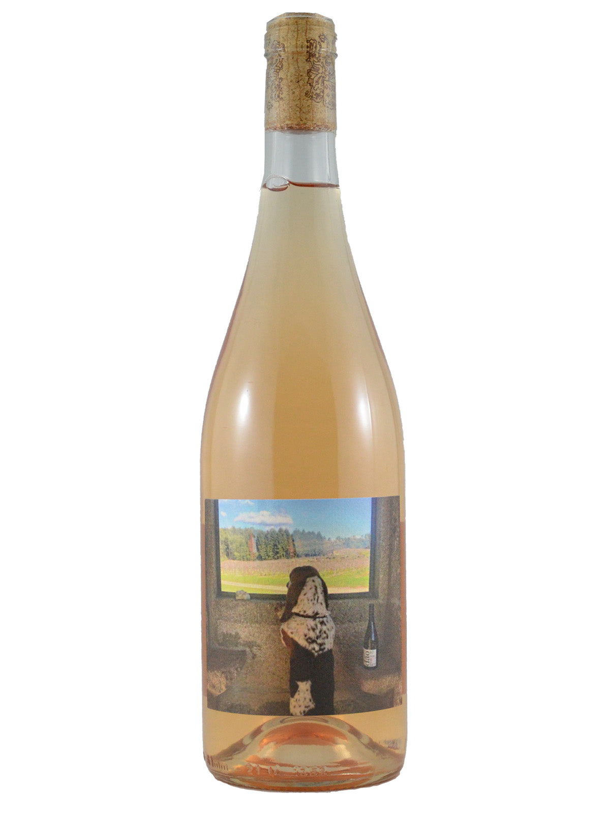 Wine bottle with a label featuring a scenic view and person, on a white background