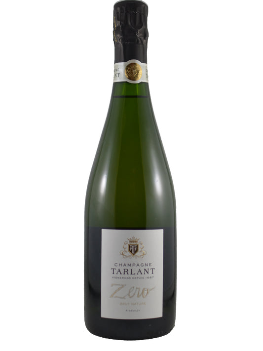 A bottle of Champagne Tarlant Zero non-alcoholic sparkling wine, featuring a dark green glass bottle, black foil, and a white label with gold and black text and a Tarlant coat-of-arms. All set against a plain white background.