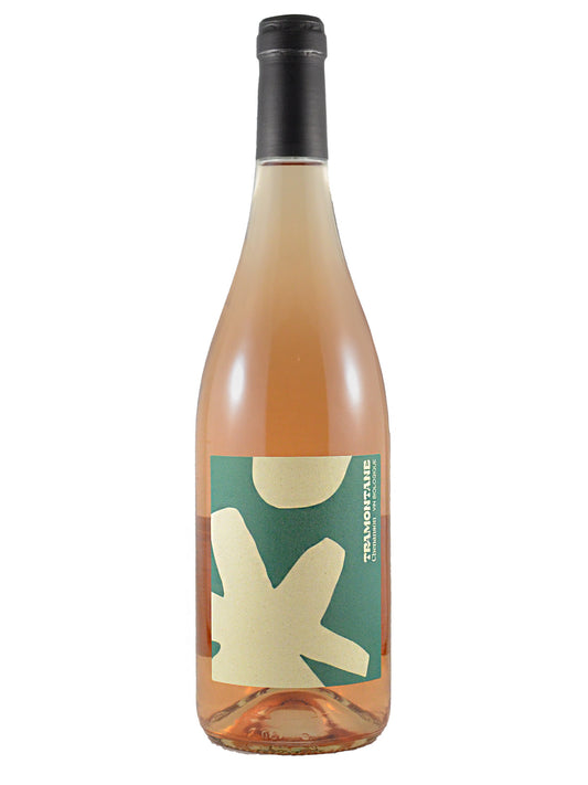 A bottle of Rosé wine with a dark gunmetal coloured enclosure and a green and cream label featuring an abstract design. The brand name 'TRAMONTANE' is visible on the label. All set against a white background.