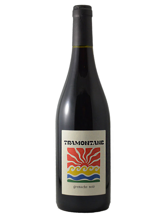 Bottle of Tramontana Grenache Noir red wine with a colourful "waves against sunset" logo on a white label. Black enclosure. All set against plain white background.