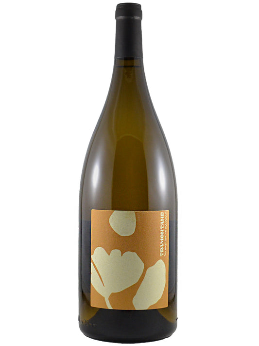 A glass magnum-sized wine bottle with a black enclosure and a rectangular label featuring a warm orange background with large cream floral shapes. The vertical text on the right side of the label reads 'TRAMONTANE'.