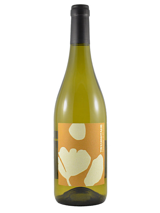 A bottle of Tramontane Vermentino white wine with a dark gunmetal enclosure and a distinctive orange and cream label featuring abstract floral shapes. All set against a plain white background.