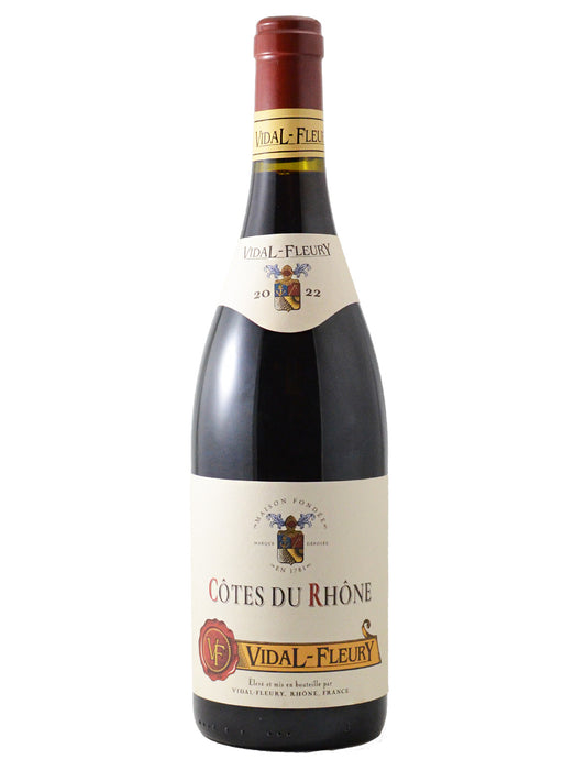 Bottle of Vidal-Fleury Côtes du Rhône Rouge with label displaying the brand and variety.