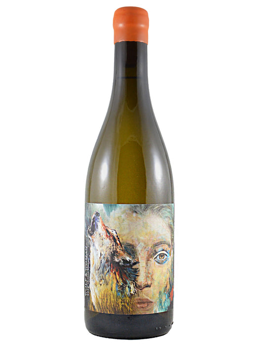 Wine bottle with artistic label with a painterly image of a howling wold over a woman's face. Orange wax enclosure. Set against plain white background.